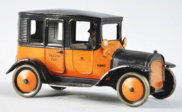 Tin Litho Bing Yellow Taxi Wind-Up Toy.: Description German. Working. Marked "Yellow Taxi" and "Germany" on back doors. Original male driver, headlights, spare tire in rear, and taxi meter with flag. Rear doors open. Slight scratching and we