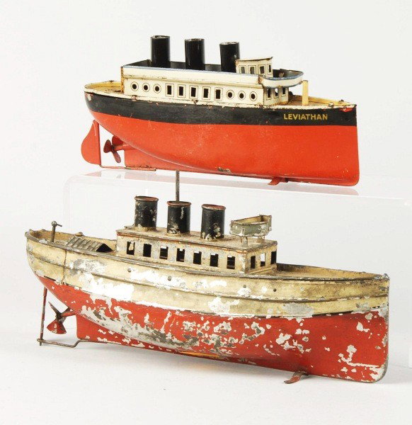 Lot of 2: Tin Boat Wind-Up Toys.: Description German. Working. Includes one Bing Ocean Liner and one Carette handpainted River Boat. Both boats missing masts. River boat retains 60% of its original paint. Condition (Good - Very Good).