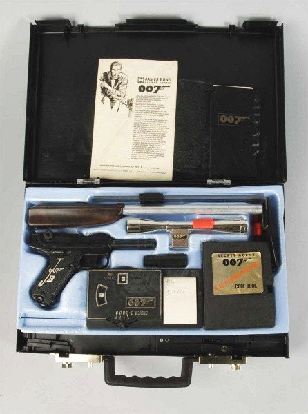 Multiple Products James Bond Attaché Case.: Description Secret Agent 007 plastic case includes pamphlet, money, guns, code book, original pencil, bullets, etc. Knife and one bullet appear to be missing. Includes plain box that may or may not be