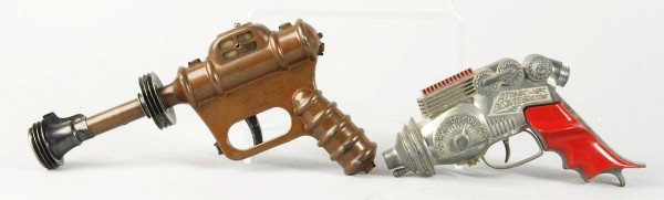 Lot of 2: Disintegrator Gun Toys.: Description American. Includes one tin Buck Rogers 25th Century gun made by Daisy in scarce copper variation and one diecast Hubley Atomic Disintegrator with plastic grips. Some wear overall, especial