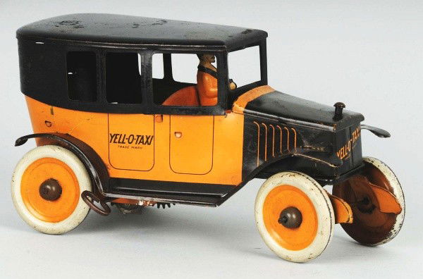 Tin Strauss Yellow Taxi Wind-Up Toy.: Description American. Working. Lithographed driver. Marked "Ferdinand Strauss" on rear and "Yellow Taxi" on doors. Some overall scratching and wear, especially to roof. Condition (Very Good - Excellen