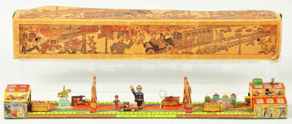 Tin Litho Marx Main Street Wind-Up Toy.: Description American. Working. Complete with policeman and vehicles. Toy is clean overall with very little wear. Includes colorful original box with some tape on one corner and some creasing and teari