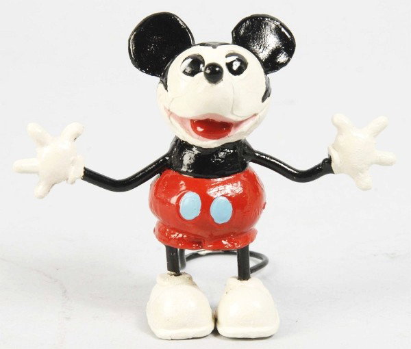 Cast Walt Disney Mickey Mouse Standing Figure.: Description German. Hands-out Mickey with long tail. Nice depiction of Mickey figure but has been restored. Condition (Restored). Size 3" T. Dimensions:3" T.