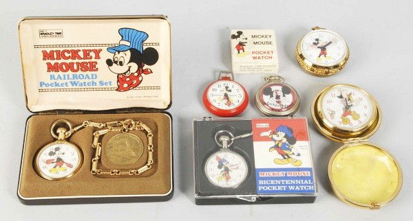 Lot of 6: Walt Disney Character Pocket Watches.: Description Circa 1970s. All are working. Includes five Mickey Mouse (three in original boxes) and one Pinocchio. Condition (Very Good - Excellent). Size Largest Box: 6" x 3 - 3/4". Dimensions:Largest