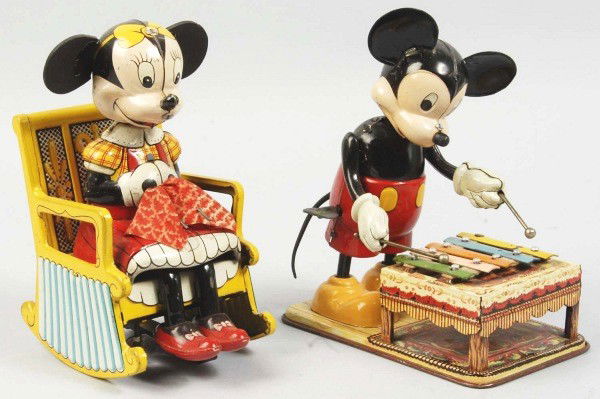 Lot of 2 Tin Linemar Mickey & Minnie Wind-Up Toys: Description Japanese. Working. Includes Minnie Mouse Knitting with original ears and knitting cloth and Mickey Xylophone Player with original tail, ears, and nose. Both toys with some scratching and w