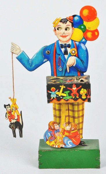 Tin Litho Balloon Vender Wind-Up Toy.: Description German. Working. When in operation, right arm moves up and down, eyes move, and tin litho pack of toys moves up and down. Pack of toys includes Mickey Mouse, teddy bear, and cat. Minor scr