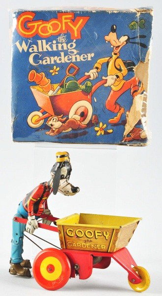 Tin Litho Marx Goofy the Gardener Wind-Up Toy.: Description American. Working. Goofy has original hardened rubber ears and is missing plastic tool set. Some oxidation and pitting inside of cart and some scratching and wear overall. Includes partial