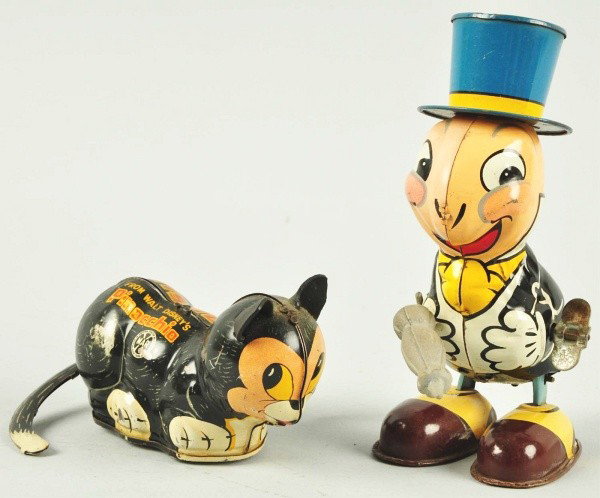 Lot of 2: Tin Litho Marx Wind-Up Toys.: Description American. Working. Includes one Figaro the Cat marked "From Walt Disney's Pinocchio" with one replaced ear and one hopping Jiminy Cricket holding original rubber umbrella. Some litho loss