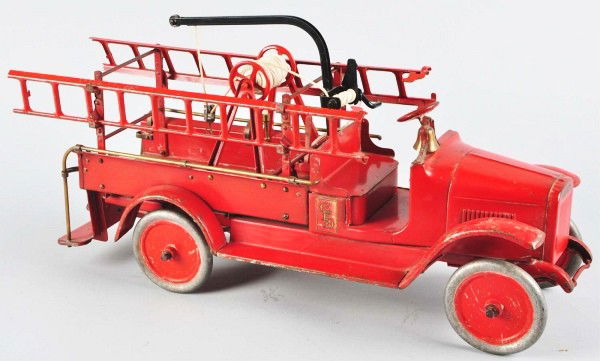 Pressed Steel Buddy L Hook and Ladder Fire Truck.: Description American. Circa 1925. Light red version, open front cab with brass bell, includes ladder racks, two ladders, a replacement wrecking boom and a replacement rope on hose reel. Moderate play