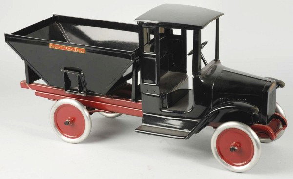 Pressed Steel Buddy L Coal Truck.: Description American. Circa 1925. Enclosed front cab and coal service body with side gates and replacement coal chute. Professional restoration to a complete, original toy. Condition (Restored). Size 