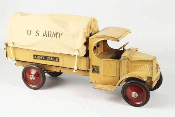 Pressed Steel Steelcraft Army Truck.: Description American. Circa 1928. Mack C-cab front, open rear body, replacement canvas, and complete decals. All original toy with moderate paint scratches. Condition (Very Good). Size 25 - 1/2" L. Di