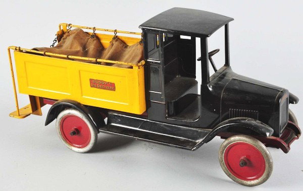Pressed Steel Buddy L Ice Delivery Truck.: Description American. Two original blocks of ice and tongs included. Truck maintains its original canvas; yellow and black body has a complete paint brush overpaint. Condition (Good). Size 26" L. Dime