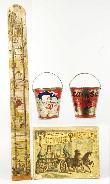 Lot of 4: Early Miscellaneous Child's Items.: Description Includes two sand pails depicting scenes of kids playing at beach with rust to insides and overall wear to outsides. Also includes one wooden ladder game with Palmer Cox Brownies and some 