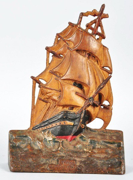 Cast Iron "The Constitution" Doorstop.: Description Marked "Copyright 1924 by A.M. Greenblatt Studios, Boston, Mass.". Condition (Very Good). Size 11 - 1/2" T. Dimensions:11 - 1/2" T.