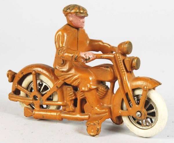 Cast Iron Hubley Harley Civilian Motorcycle Toy.: Description American. Scarce orange color variation with flesh colored face. Dual headlights. Embossed "Harley Davidson" in gold lettering on left side of gas tank. White rubber wheels are replacement