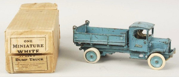 Cast Iron Arcade White Dump Truck Toy.: Description With original box. Painted blue with "White" embossed on doors and grille. Enclosed cab features seated nickel driver, dual rubber rear tires with disc wheels, dump lever on side and tailg