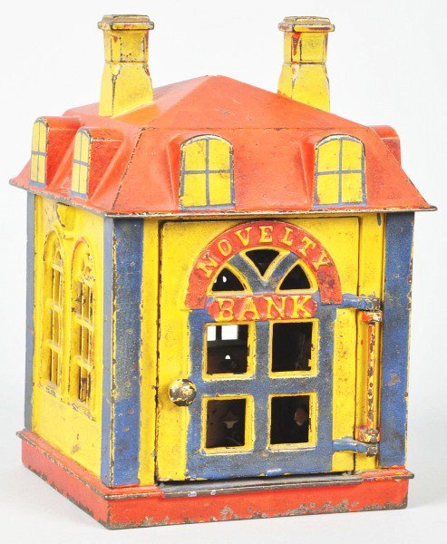 Cast Iron Novelty Mechanical Bank.: Description Manufactured by J. & E. Stevens Co. Designed by C. C. Johnson, patented 10/28/1873. After the cashier receives the coin, a slight touch causes the door to close. The coin is deposited thro