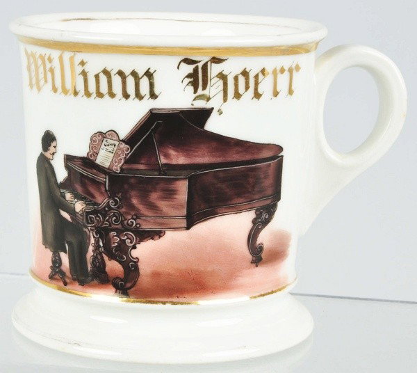 Pianist Shaving Mug.: Description Impressive example. Detailed image of man playing an ornate grand piano with individual keys visible. Marked "William Koerr" across top. Condition (Excellent). Size 3 - 3/4" T. Dimensions:
