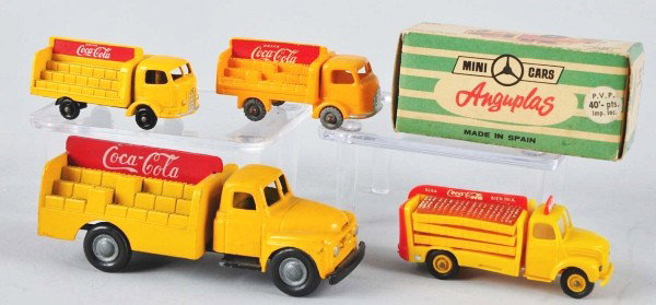 Lot of 4: Assorted Coca-Cola Truck Toys.: Description Includes an Anguplas with original box; a four-inch micro model; and two two-inch Lasneys. All are very clean with only a little dust and no wear. Condition (Near Mint - Near Mint Plus). S