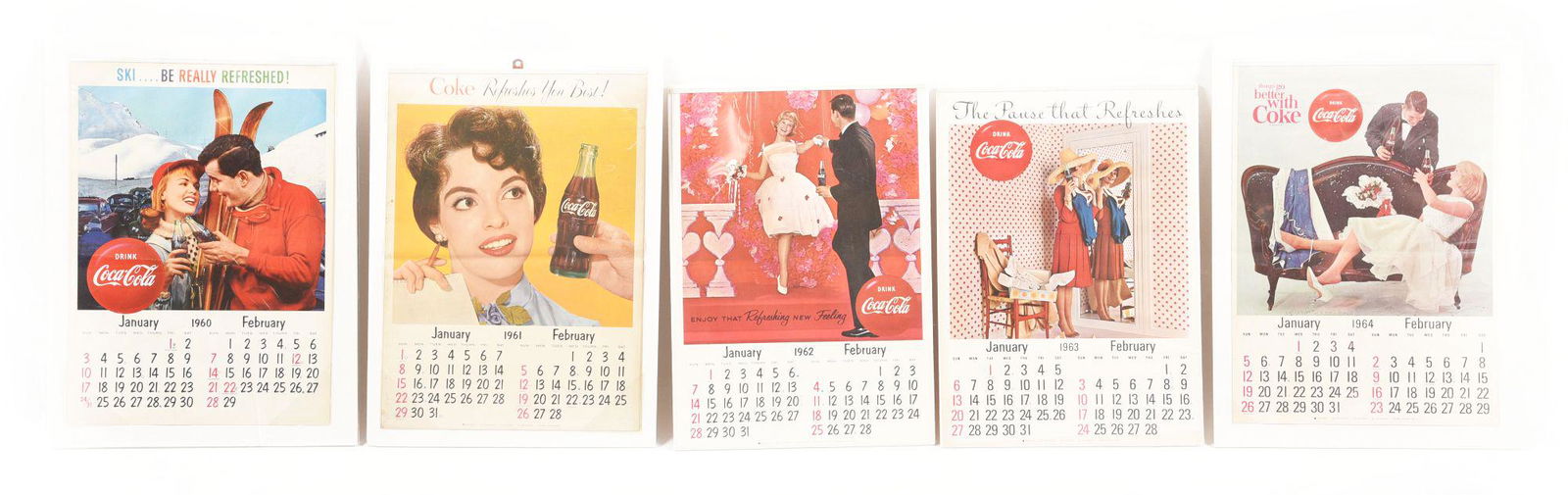 LOT OF 5: COCA-COLA PAPER LITHOGRAPH CALENDARS.: This is a lot of five Coca-Cola calendars. The first is from January 1960, with great color, a couple bends and a little bit of staining to it. The second reads "Coke Refreshes You Best" and is from 1