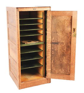 THE GLOBE-WERNICKE CO. FILE CABINET.: A fantastic oak locking vertical file cabinet that could have many uses. Made by the Globe-Wernicke company, the interior has metal adjustable shelves. With a locking retractable door! Would make a gr