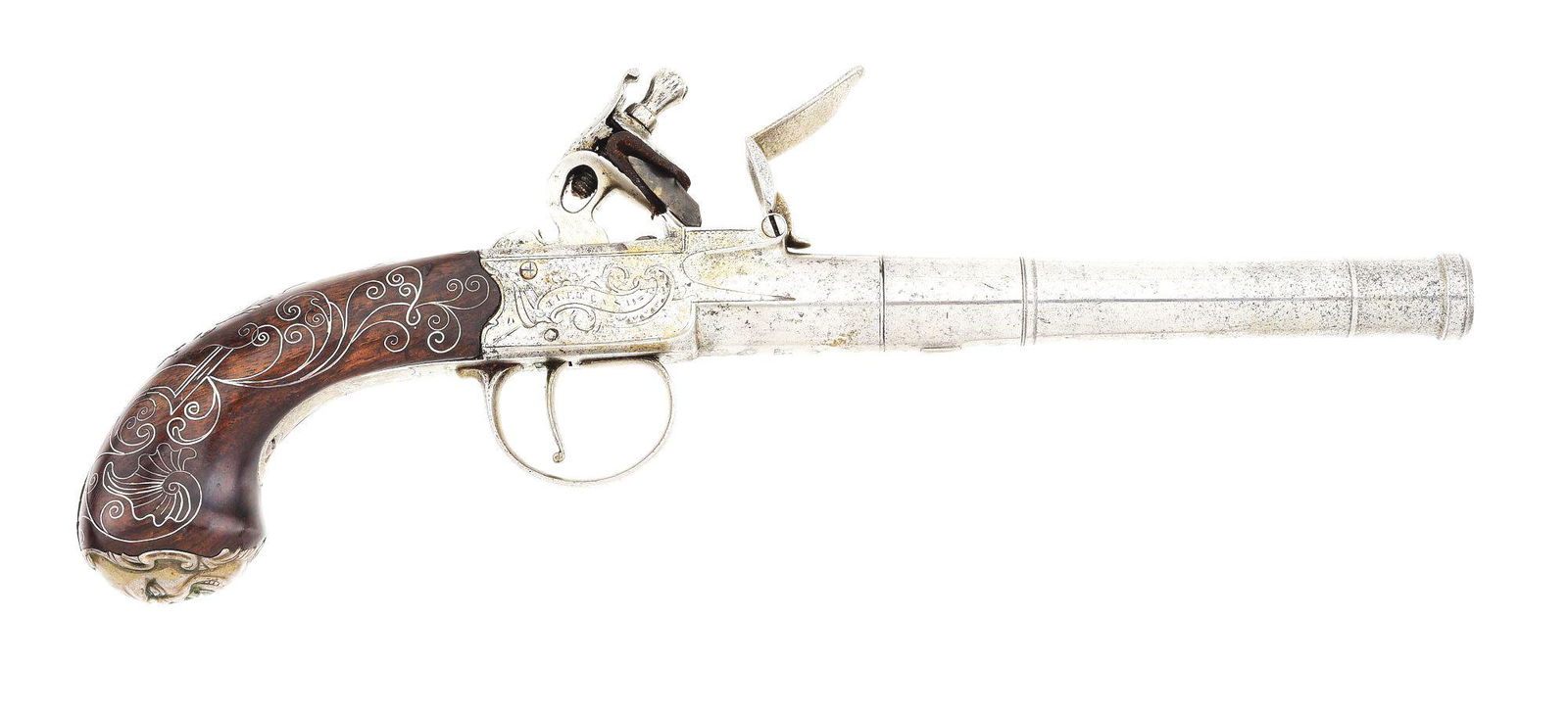 (A) LARGE SILVER MOUNTED ENGLISH BOXLOCK FLINTLOCK PISTOL BY T. KETLAND & CO.: Round removable screw barrel with several turnings and a cannon muzzle, bottom of breech shows London view and proof marks, as well as "TK" for Thomas Ketland. The scalloped boxlock action is engraved