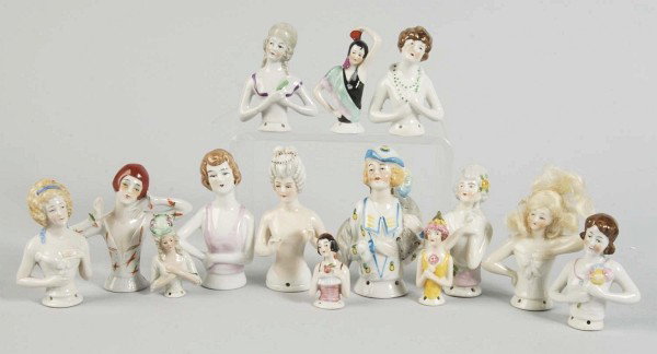Lot of 14: German Porcelain Half Dolls.: Interesting lady with fox fur and molded hat (repair on base); art deco lady with arm going behind head; art deco lady with green eye shadow and red hair, hand extended; lady with wig; lady with arms 