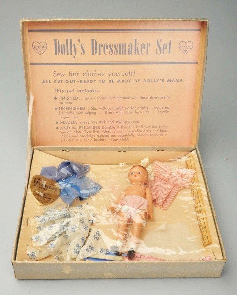 Dolly's Dress Maker Set.: Includes Effanbee miniature doll in original box, extra dresses and heart shaped Effanbee tag in box. Size: Doll: 5 - 1/2" T.