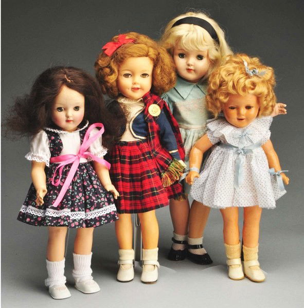 Lot of 4: Ideal Dolls.: Includes two hard plastic dolls with green sleep eyes, a 1930s era Shirley Temple doll made of composition and a 1970s era Shirley Temple vinyl doll. Composition Shirley doll has some composition loss