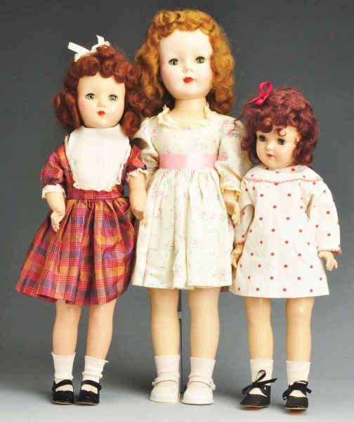 Lot of 3: Hard Plastic Dolls.: Ideal P-92 pre-Toni Doll with reddish brown mohair wig, redressed with original shoes and socks; R & B "Nanette" walker (nose rub), redressed; American Character "Sweet Sue Walker," dress and matching