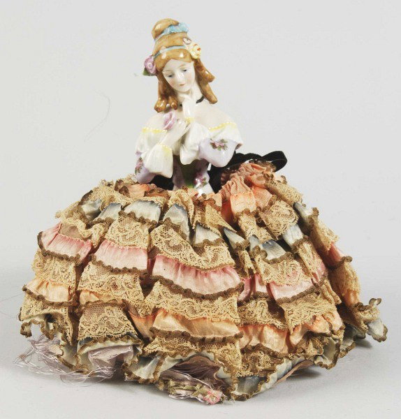 Goebel "Jenny Lind" German Porcelain Half Doll.: Signed with F. & W. Goebel trademark and stamp. Lovely detailing of hair and gown with rose flower decals, arms away holding a molded rose, lovely original ribbon and lace base (some deterioration to 