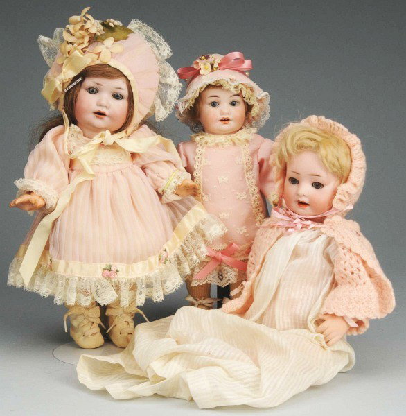 Lot of 3: German Bisque Character Dolls.: Revalo, sleeping eyes, open mouth with molded teeth, 5-piece baby body (cracking); 2 A.M. 971, sleeping eyes, open smiling mouth, 5-piece composition toddler bodies (wear on fingers, discoloration on 