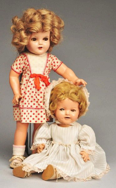 Lot of 2 Ideal "Shirley Temple" Baby & Girl Dolls: All composition later model with Shirley Temple body, unmarked head, flirty brown eyes (crack on one), eye shadow, open mouth with upper teeth, mohair wig (recurled), replaced dress, scuffed compo. Ra
