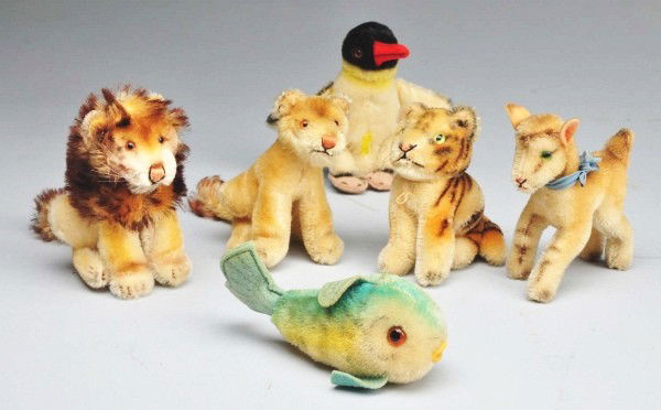 Lot of 6: Steiff Animals.: Includes one two lions, one penguin, one deer, one fish, and one tiger. No ear buttons or chest tags. Size: Largest: 5 - 1/2" L.