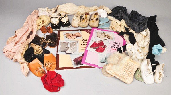 Lot of Vintage Shoes and Stockings.: At least 25 pairs of new and vintage doll shoes, six pairs of vintage and antique children's shoes, satin booties with fur trim, six pairs of booties, vintage and new stockings, and vintage adult stoc