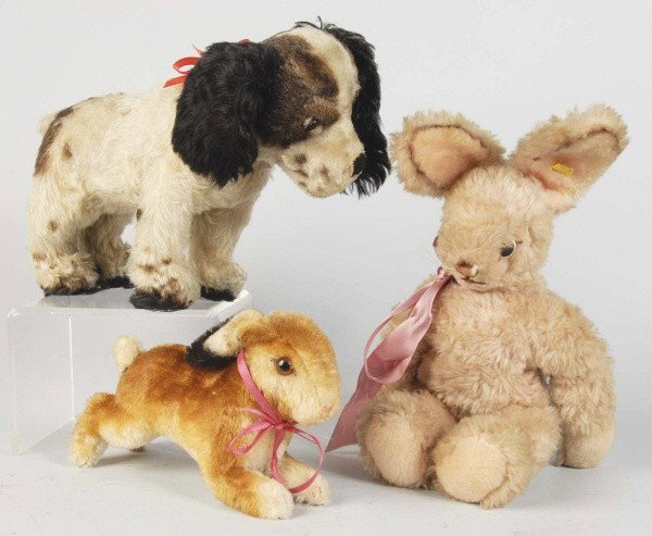 Lot of 3: Vintage Steiff Animals.: Black, tan and cream mohair dog with turning head (some mohair loss around eyes); plush bunny with metal button and yellow tag (light soil); running bunny with U.S. Zone Germany label, metal button (s