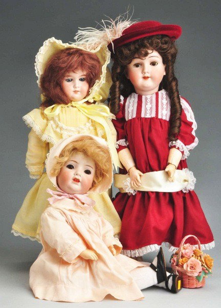 Lot of 3: German Bisque Child Dolls.: Max Handwerck 285/28.5, sleeping eyes with replaced upper eyelashes, open mouth with teeth, replaced wig, jointed composition body, redressed; Franz Schmidt 1310/1296 character head (piece broken and 