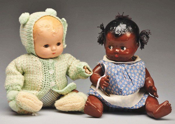 Lot of 2: Effanbee Composition Babies.: Rare and wonderful brown "Patsy Baby" marked head and body, black molded hair, three yarn pigtails, painted side-glancing eyes, vintage dress, metal heart. "Patsy Baby" with blonde molded hair, brown