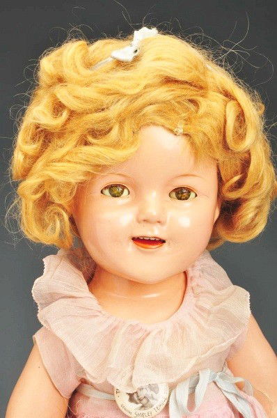 Ideal Composition 1930s Shirley Temple.: Fully marked on head and body, original blonde wig (a little mussed), lashed sleeping eyes (crackled), open smiling mouth with dimples, totally original tagged pink organdy dancing dress, undies, shoe
