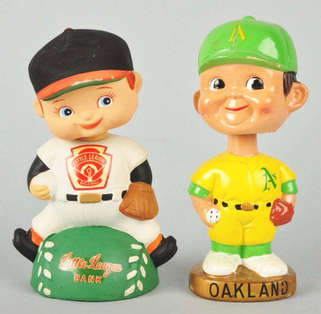 Lot of 2: Baseball Bobbing Head Dolls.: Includes one Oakland A's with yellow uniform and one Little Leaguer, which is also a bank, marked "Lego" on bottom. Some slight chipping and wear to Little Leaguer brim and one small chip underneath o