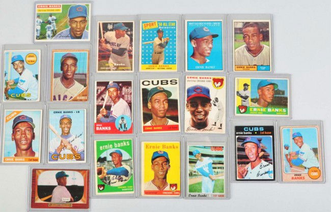 Lot of 19: Ernie Banks Baseball Cards.: Includes 1955 Bowman, 1954 Topps Rookie card, and 1956 through 1964 and 1966 through 1971 Topps cards. The 1962 car is cut incorrectly, the 1964 has one crease, and the 1966 has one small crease at to