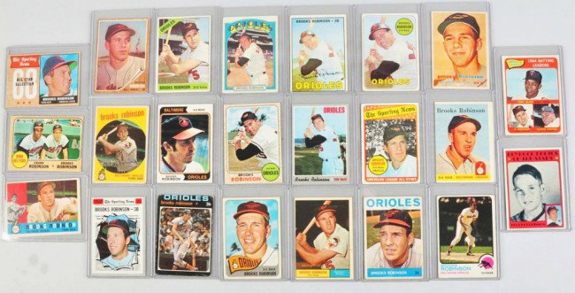 Lot of 23: Topps Brooks Robinson Baseball Cards.: Cards begin in 1957 with no. 328 and go through 1974. The two nicest cards in lot include the 1968 (nicely centered) and the 1970. The 1957 card has a one-inch crease in left corner. Condition: (Very 