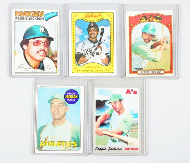 Lot of 5: Reggie Jackson Baseball Cards.: Topps and Kelloggs. Includes 1969 rookie card and 1970 second-year card. Rookie card with slightly dog-eared corners and off center from left to right and second-year card is centered well with slight