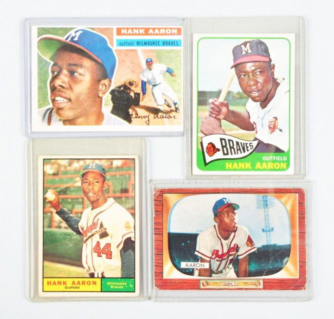 Lot of 4: Hank Aaron Baseball Cards.: Includes Topps 1956 with nice color (off centered top to bottom and left to right), Topps 1961, Topps 1965, and Bowman 1955 (with creases throughout). Condition: (Very Good).