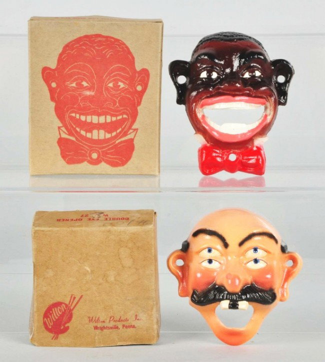 Lot of 2: Cast Iron Wall Mount Bottle Openers.: Manufactured by Wilton. Includes black face and bald four-eyed man. Both with original boxes. Size: Largest: 4 - 1/4" T. Condition: (Near Mint).
