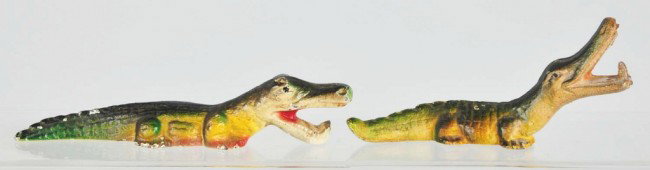 Cast Iron Alligator Bottle Openers.: Includes alligator with head up by John Wright and alligator with head down by Wilton. Size: Largest: 6 - 1/4" L. Condition: (Very Good).