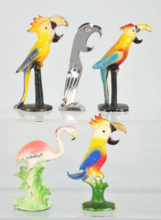 Lot of 5: Cast Iron Bottle Openers.: Includes four parrots (one in chrome with corkscrew) and one flamingo in white metal. Size: Largest: 5 - 1/2" T. Condition: (Very Good).
