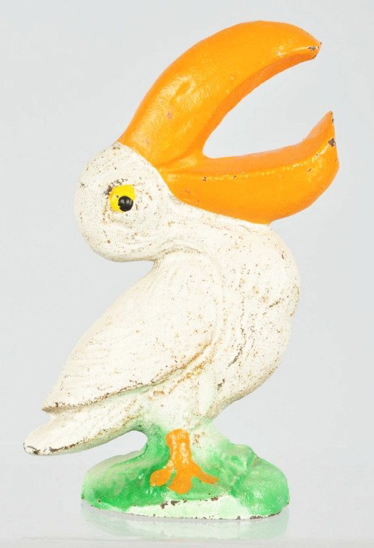 Cast Iron Pelican Bottle Opener.: Manufactured by John Wright. Size: 4" T. Condition: (Very Good).