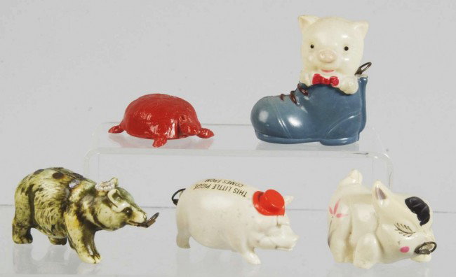 Lot of 5: Figural Sewing Tape Measures.: Includes one red turtle, one pig with hat, one pig in boot, one bear, and one running pig. All with full tape measures except for the red turtle. Size: Largest: 2 - 5/8" L. Condition: (Excellent).
