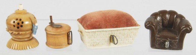 Lot of 4: Figural Sewing Tape Measures.: Includes one celluloid chair with short tape, one celluloid wind-up, one basket with pin cushion, and one wind-up fishing reel. Size: Largest: 2 - 1/4" L. Condition: (Excellent).